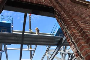 Steel work next to historic brick work